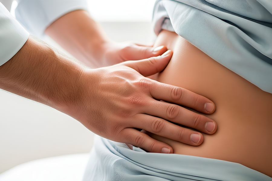 お腹の不調で悩む患者のイメージ
